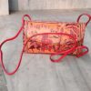ochre and red leather sling bag