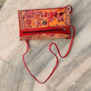 Ochre and red leather sling bag