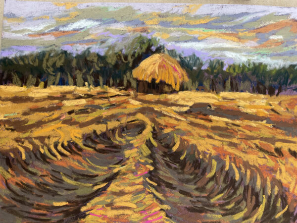 Dry pastel painting of a post-harvest paddy field with swirling furrows in the soil, a central haystack hut, and tree line under a moody grey-lavender sky.
