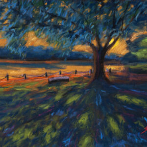 Dry pastel painting showing a large tree beside a calm lake at sunset, a bench under the tree, and golden light reflecting on water. Artwork by Saikat Mondal