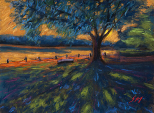 Dry pastel painting showing a large tree beside a calm lake at sunset, a bench under the tree, and golden light reflecting on water. Artwork by Saikat Mondal