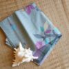 Pastel floral handwoven cotton saree from Bengal with grey base and colorful motifs