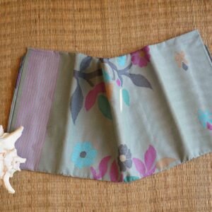 Pastel floral handwoven cotton saree from Bengal with grey base and colorful motifs