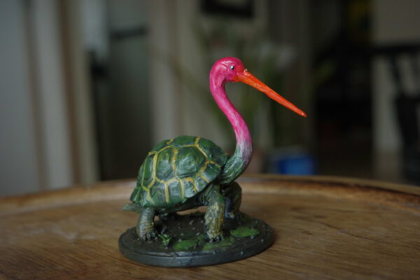 Bokocchop-sukumar-roy Bokocchop (বকচ্ছপ) hand-painted collectible miniature inspired by Sukumar Roy’s Abol Tabol, featuring the whimsical stork-tortoise hybrid on a display base