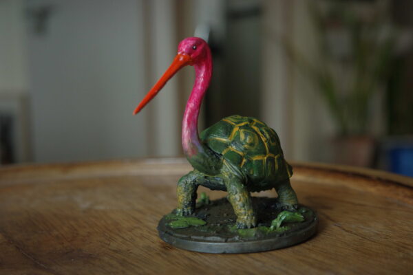 Bokocchop-sukumar-roy Bokocchop (বকচ্ছপ) hand-painted collectible miniature inspired by Sukumar Roy’s Abol Tabol, featuring the whimsical stork-tortoise hybrid on a display base