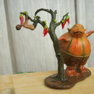 Kumro Potas (কুমড়ো পটাশ) | Abol Tabol Collectible Miniature 2 Front view of the Kumro Potash collectible sculpture with wooden display base