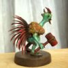 Bhoy-Peyo-Na-Sukumar-Roy Voy Peyo Na (ভয় পেয়ো না) hand-painted collectible miniature inspired by Sukumar Roy’s Abol Tabol, featuring the humorous horned character holding a lantern and club on a wooden display base