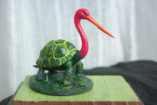 Bokocchop-sukumar-roy Bokocchop (বকচ্ছপ) hand-painted collectible miniature inspired by Sukumar Roy’s Abol Tabol, featuring the whimsical stork-tortoise hybrid on a display base