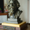 Hand-painted Rabindranath Tagore collectible tabletop sculpture mounted on a wooden display base from the Ghodadum Bengal Heritage Collection